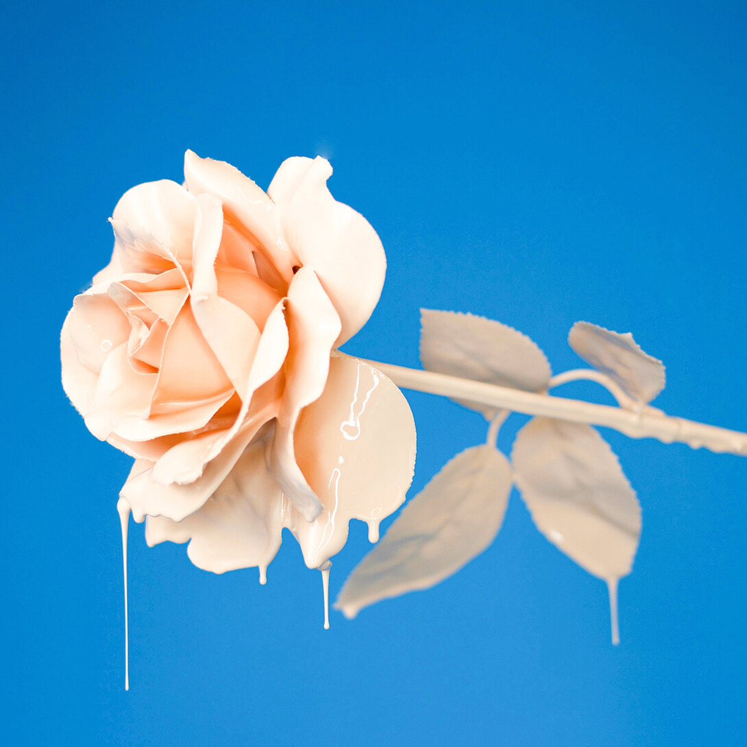 A painted rose that is dripping