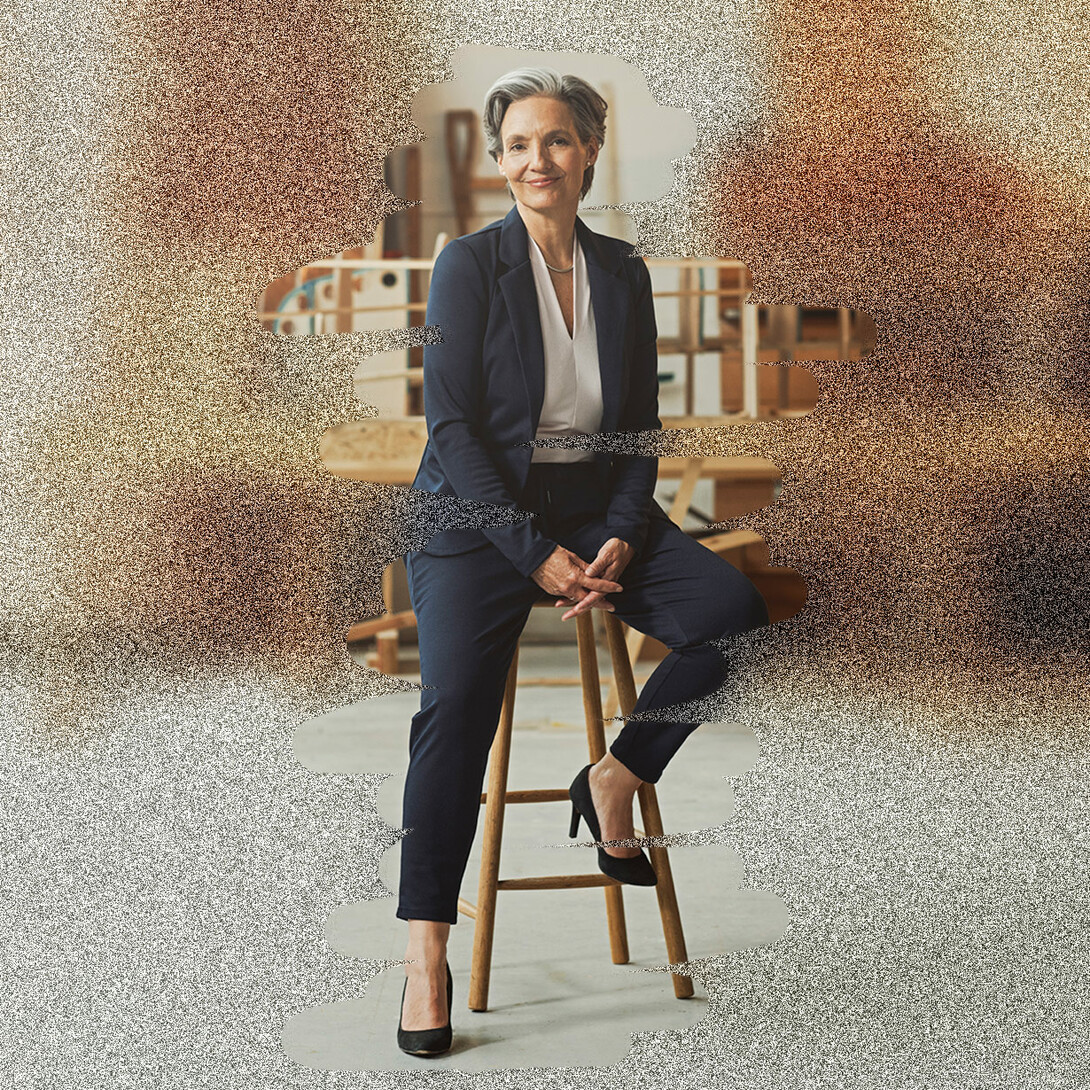 A noisy image with a woman sitting on a chair
