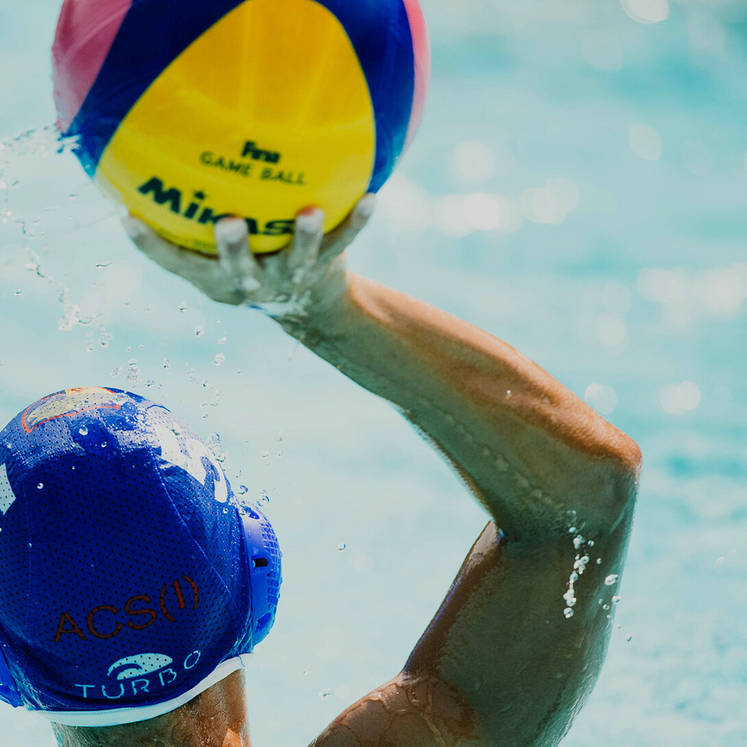Water polo player passing the ball